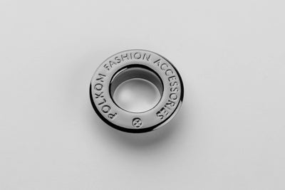 Œillet métallique avec inscription de marque couleur nickel noir / gunmetal (nickel free) pour collections homme