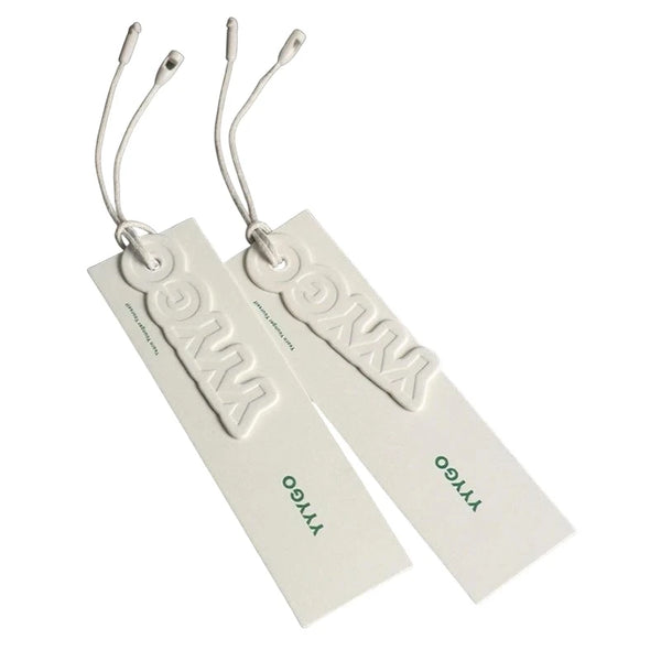White hang tags with embossed logo and textile string with plastic tip
