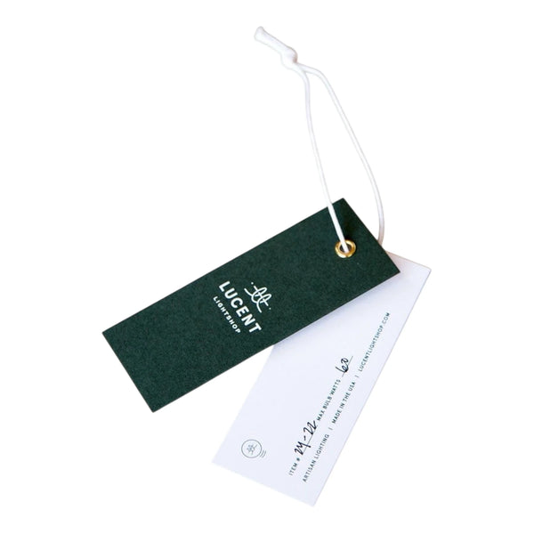Green and white hang tag with metal eyelet and white elastic string