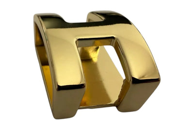 Premium metallbälteshållare 25 mm i spegelblankt guld med dekorativ öppen form