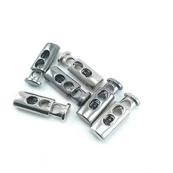 Fermacorda in metallo a due fori color nichel (nickel free) e gunmetal