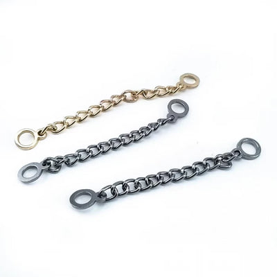 Three hanger chains with round ends – gold and gunmetal, diagonal layout