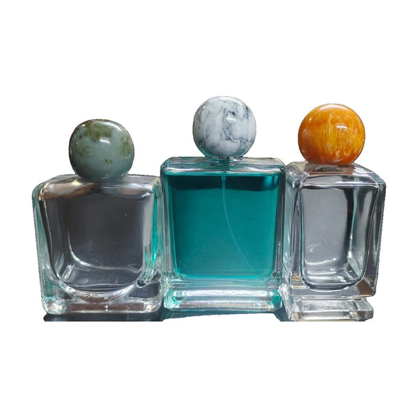 Kugleformede polyesterlåg til parfume – marmoreffekt