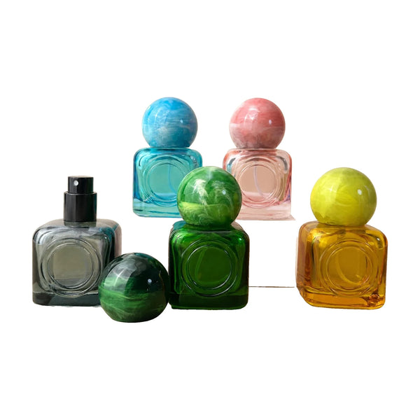 Kugleformede polyesterlåg til parfume – marmor og farve